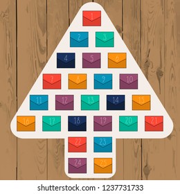 Abstract Christmas tree with colorful envelopes on wood background. Advent calendar