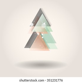 Abstract christmas tree icon or logo concept. Silhouette of evergreen treebuild with colorful abstract triangles with added text and snowflakes.