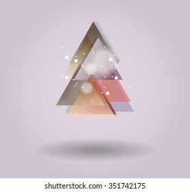 Abstract christmas tree icon or logo concept. Silhouette of evergreen tree build with colorful abstract triangles with added text and snowflakes.