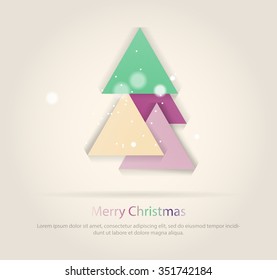 Abstract christmas tree icon or logo concept. Silhouette of evergreen tree build with colorful abstract triangles with added text and snowflakes.