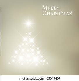 Abstract Christmas tree made of light and sparkles flakes