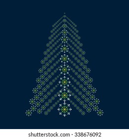 Abstract Christmas tree from snowflakes. Green tree silhouette on a blue background