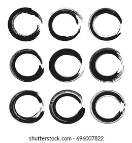 Abstract circles set frames of thick black textured paint smears isolated on white background