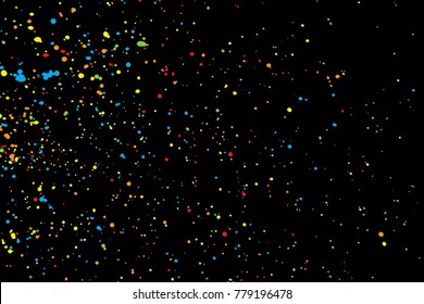 Abstract color splash illustration on black background. Colorful confetti on dark background. Calligraphy ink drop on paper random pattern background in color. 