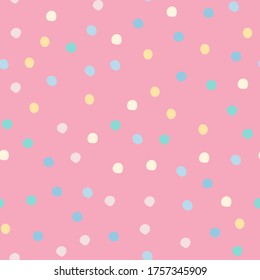 Abstract colored polka dots seamless pattern on pink background. Cute circle shapes wallpaper. Decorative backdrop for fabric design, textile print, wrapping, cover. Vector illustration.