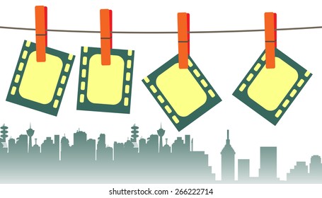 Abstract colorful background with four filmstrips hanging on clothesline