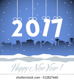 Abstract colorful background with the number 2017 hanging from above and the text Happy New Year written below
