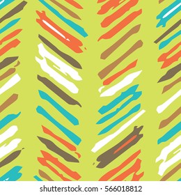 Abstract colorful background with repeating structure of hand drawn colorful strokes. Vector seamless pattern.