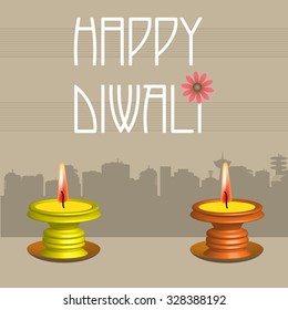 Abstract colorful background with two candles and the text Happy Diwali written with white letters