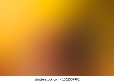 Abstract colorful smooth blurred background in soft gold colours