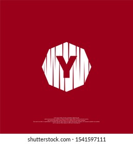 abstract cracked octagonal shape with bold Y logotype simple design concept isolated on dark red background.