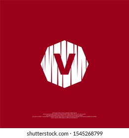abstract cracked octagonal shape with bold V logotype simple design concept isolated on dark red background.