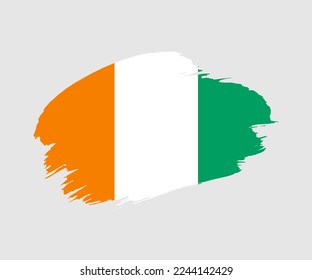 Abstract creative painted grunge brush flag of Cote dIvoire country with background