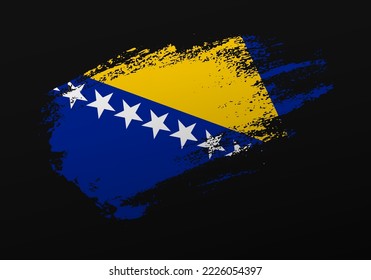Abstract creative patriotic hand painted stain brush flag of Bosnia and Herzegovina on black background