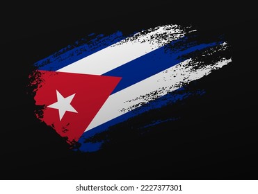 Resumen creativo patriótico con la mano pintada con la bandera de Cuba sobre fondo negro