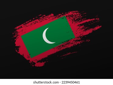 Abstract creative patriotic hand painted stain brush flag of Maldives on black background
