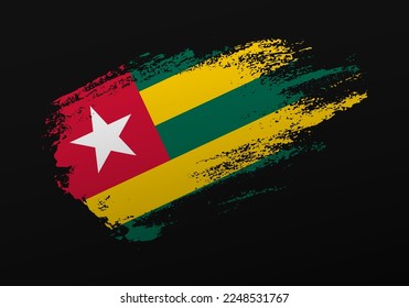 Abstract creative patriotic hand painted stain brush flag of Togo on black background
