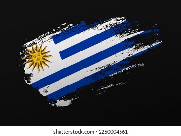Resumen creativo patriótico barniz pintado a mano con bandera de Uruguay sobre fondo negro