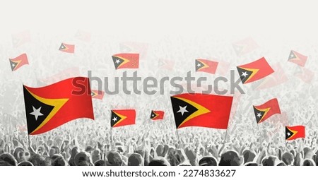 Abstract crowd with flag of East Timor. Peoples protest, revolution, strike and demonstration with flag of East Timor. Vector illustration.