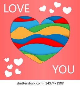 abstract cut heart on colored paper and the words love you
