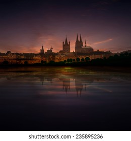 abstract dark background with clouds and silhouette of Koln