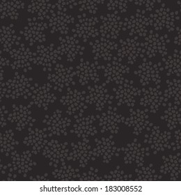 Abstract dark seamless vector pattern with a lot of spots