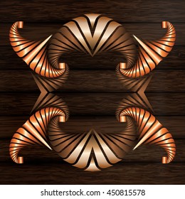Abstract decorative frame of light and dark bronze and copper elements on dark brown wooden surface