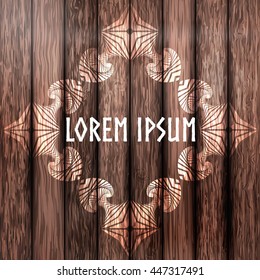 Abstract decorative frame on dark brown plank wood background