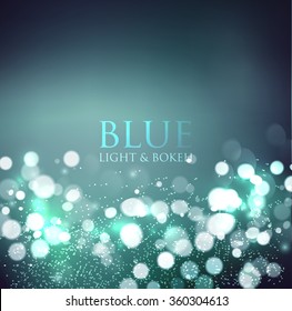 Abstract defocused christmas background. Festive elegant blue abstract background with bokeh  lights 