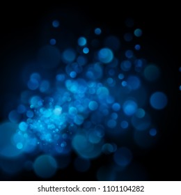 Abstract defocused circular blue bokeh on dark background. EPS 10