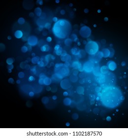 Abstract defocused circular blue bokeh on dark background. EPS 10