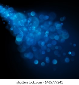 Abstract defocused circular blue bokeh on dark background. EPS 10