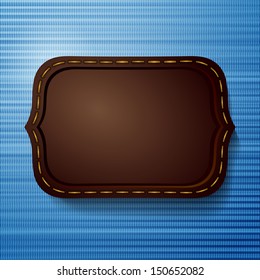 Abstract denim background with leather label 