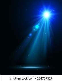 Abstract disco background with blue spot lights and bright rays.