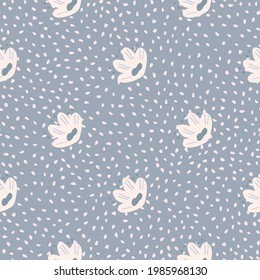 Abstract doodle seamless pattern with simple kids style white flowers silhouettes. Blue dotted background. Designed for fabric design, textile print, wrapping, cover. Vector illustration.