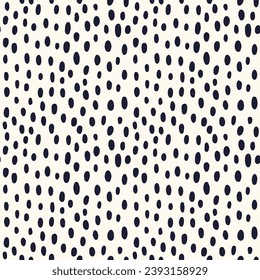 abstract dots of different sizes are scattered on a seamless background in a chaotic manner. dots and spots print for fashion fabric