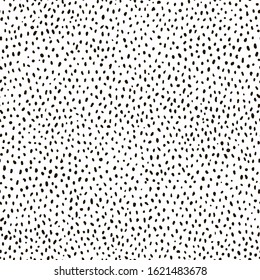 Abstract dotted background. Grunge spotted texture. Black and white seamless pattern. 