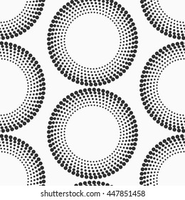 Abstract dotted circles seamless texture. Monochromatic vector pattern