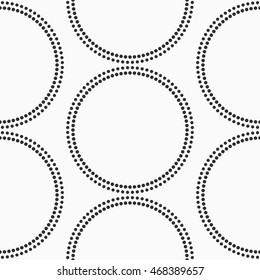 Abstract dotted circles seamless texture. Monochromatic vector pattern
