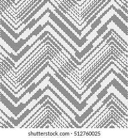 Abstract dotted zigzag motif. Seamless pattern.