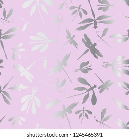 Abstract dragonfly silhouettes vector seamless background with silver shine effect. Ideal for home decor, apparel, paper goods, packaging, weddings and communions.