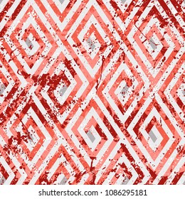 Abstract ethic geometric pattern with maze, diagonal stripes and lines in red. Op art seamless geometric background. Bold tribal print with ethnic african motif and watercolor paint