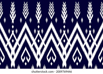 Abstract ethnic ikat chevron pattern background Traditional pattern on the fabric in  Asian countries Can be used for printing on curtains, tile patterns, paper or used decorate the walls of the home.