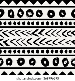 Abstract ethnic seamless repeat pattern in black and cream. Modern and stylish abstract design poster, cover, card design.