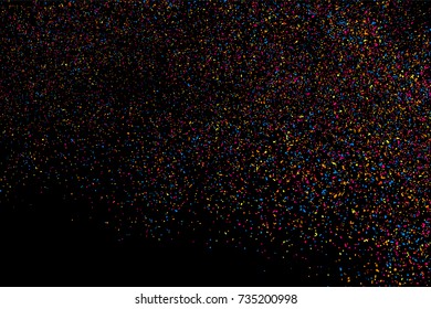 Abstract explosion of confetti. Colored stains and blots. Colorful grainy texture isolated on black background.  Vector illustration,eps 10.