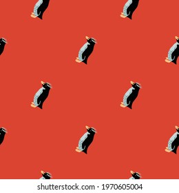 Abstract fauna seamless pattern with doodle crested penguins ornament. Red bright background. Designed for fabric design, textile print, wrapping, cover. Vector illustration.