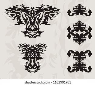 Abstract flaming dragon head and silhouettes of symbols of a dragon. Double black ethnic dragon symbols and the head of a dragon closeup on a decorative gray background for your design 