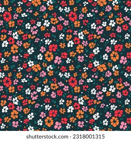 Abstract floral background. Floral pattern with small colorful flowers on a dark navy blue background. Seamless pattern for design and fashion prints. Ditsy style. Stock vector illustration.
