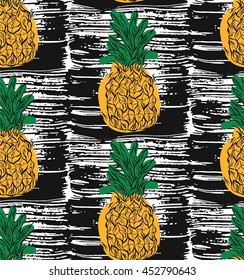 Abstract floral hand drawn vector seamless pattern with cartoon pineapples in orange and green colors on black background.