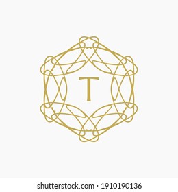 abstract floral mandala logo with the letter T in the middle. editable and easy to custom